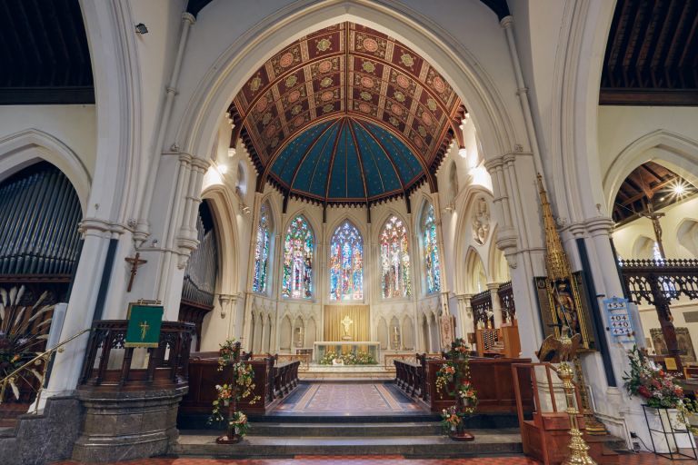 The ornate ceiling, stained-glass windows and chancel inside St George’s Church, Beckenham